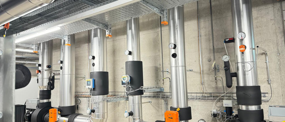 Metal-clad and insulated pipework in the plant room